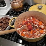 Reduce red wine and balsamic vinegar and allow the beef stew vegetables to further soften.