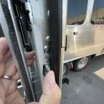 Airstream TriMark deadbolt play noted by wiggling with thumb with door open.