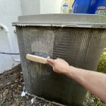 Apply soapy water to the AC condenser coils using a synthetic bristle bench brush.