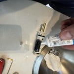 Lubricate the new faucet cartridge with silicone grease.