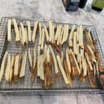 Arrange and space potato slices on rack for better browning and even cooking in oven.