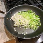 Cook chopped onion, peppers and celery over medium heat with olive oil.