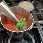 Fresh pizza sauce uses fresh basil and canned tomatoes.