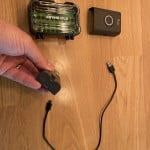 Connect the Ring doorbell battery pack to a 5v USB power source using a USB 2.0 USB A to USB micro-B cable. The charging battery with display an orange and a green light.