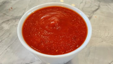 Homemade pizza sauce using canned Italian San Marzano tomatoes.