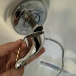 Remove shower faucet handle.