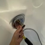 Remove faucet stop sleeve.