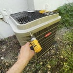 Replace the grill panels on the condenser and re-install the mounting screws.