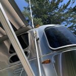 Weboost outdoor antenna mounted to an Unger cleaning pole mounted to our Airstream RV using a TechnoRV suction clamp.