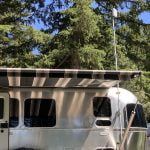 Airstream RV with mounted Weboost outdoor antenna.