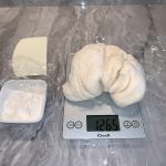Weigh the pizza dough before dividing the dough for balling.