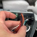 Pass the MicroAir EasyStart wire harness into the AC electrical box.