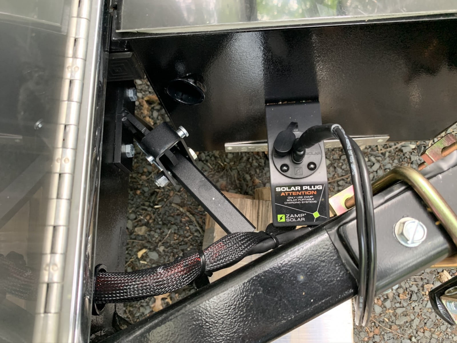 Solar plugin port for portable solar panels at the front of a new Airstream RV.